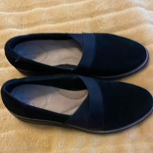 Black suede slip on shoe.